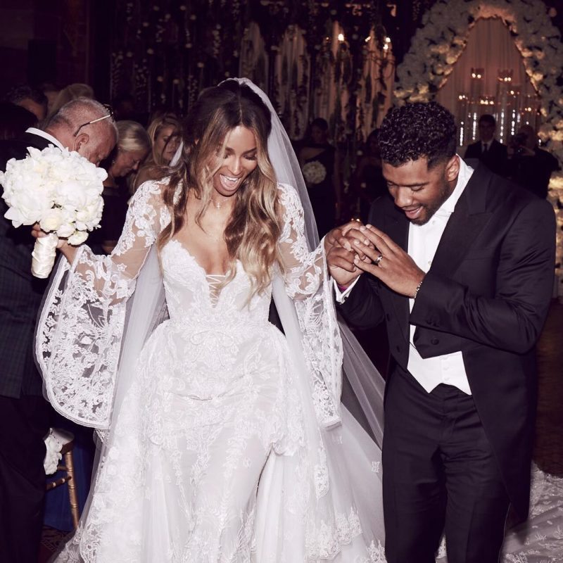 Gorgeous Pair: Russell Wilson holds onto Ciara as she stuns in a Cavalli Couture wedding dress.