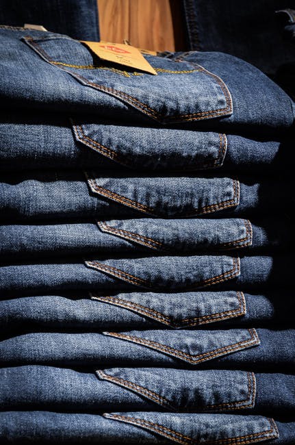 Pile of denim jeans