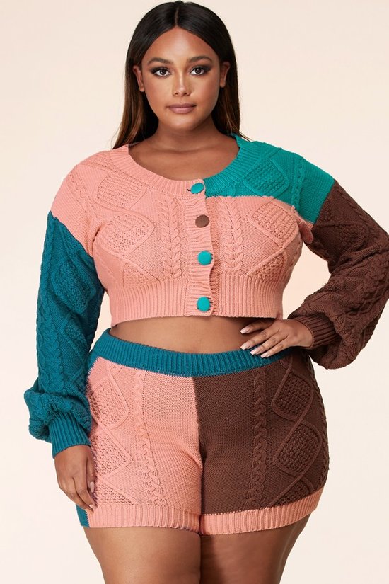 Model wearing beauty trends, a pink, blue, turquoise and brown colorblock sweater short set by Tessy.
