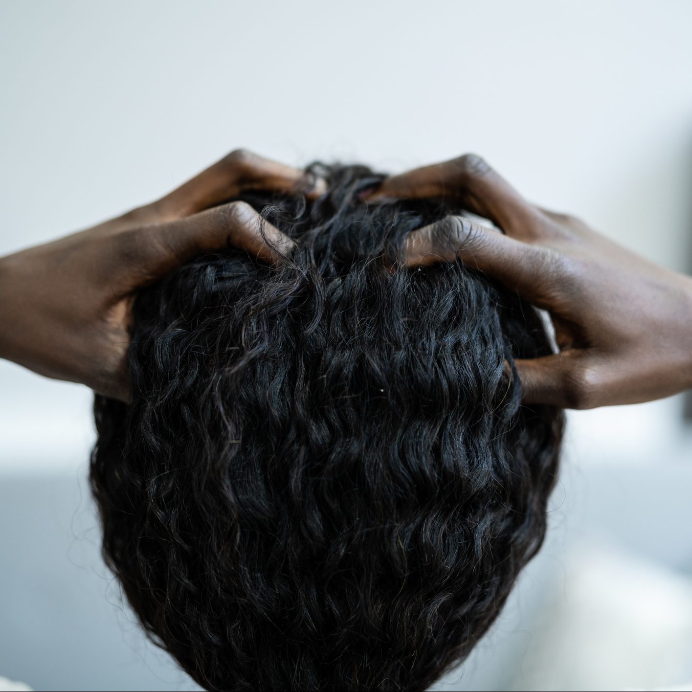 young-black-woman-scratching-itchy-scalp-reasons-why-scalp-is-itching