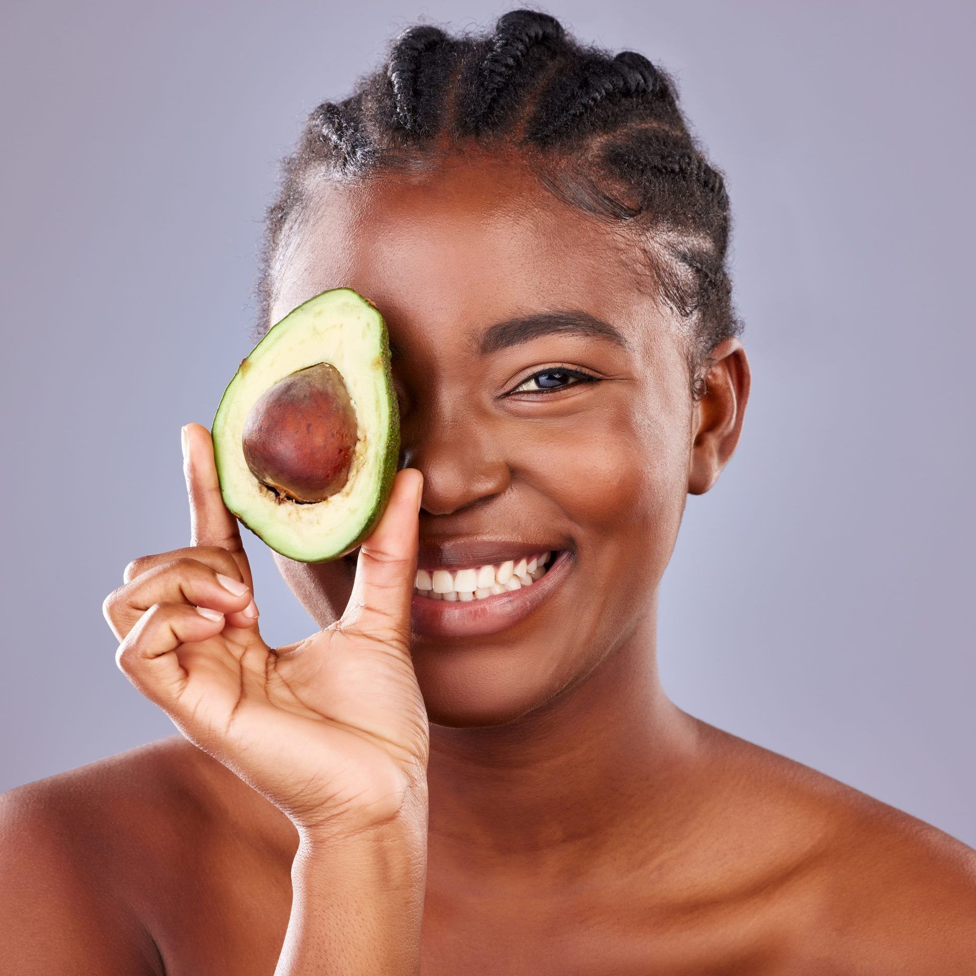 woman-holding-avocado-for-homemade-face-mask-for-skin-conditions