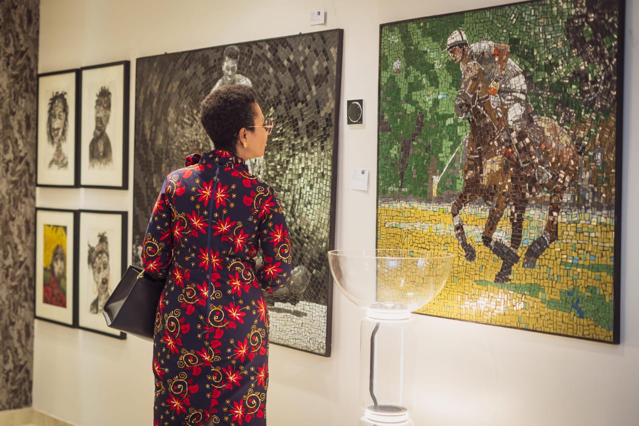 woman watches art appreciation session by Lagos Art Salon