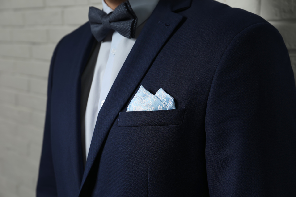 Suit with bow tie and pocket square