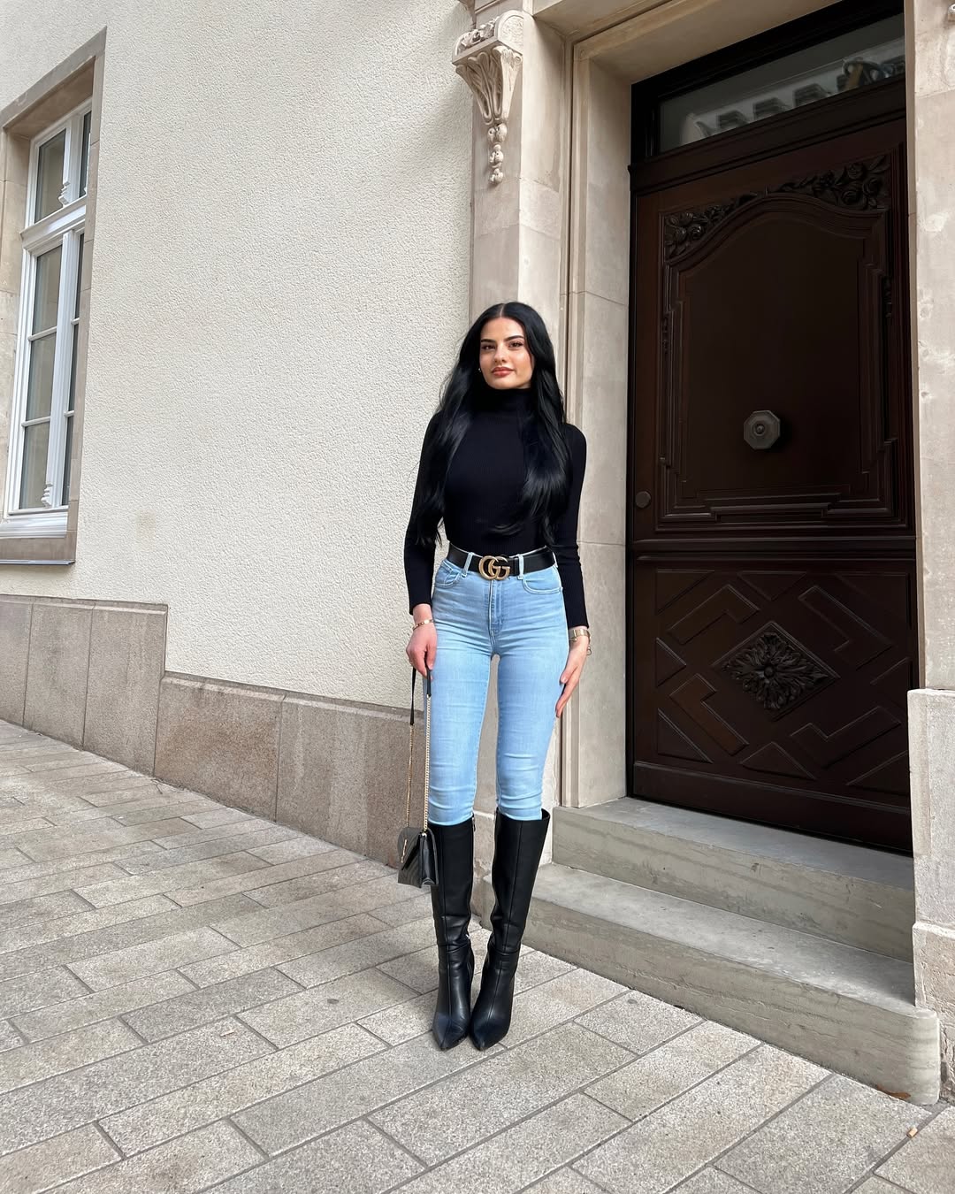 skinny jeans styled with turtleneck top and boots